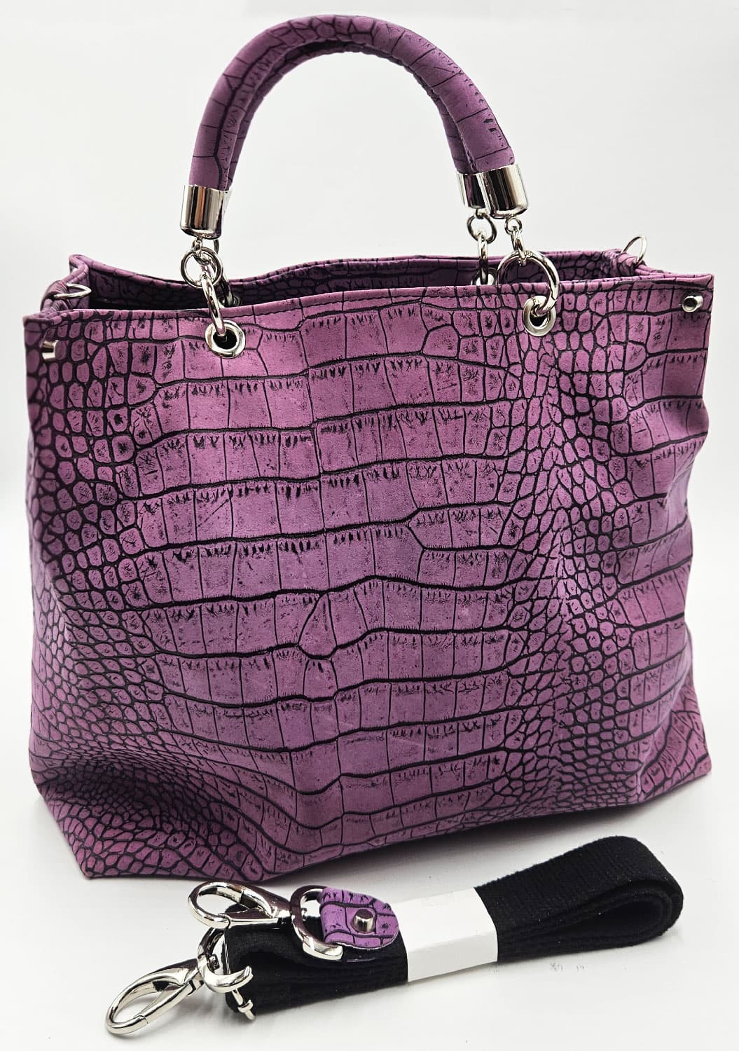 Borsa Kali malva stampa cocco con manico in pelle e tracolla staccabile accanto.